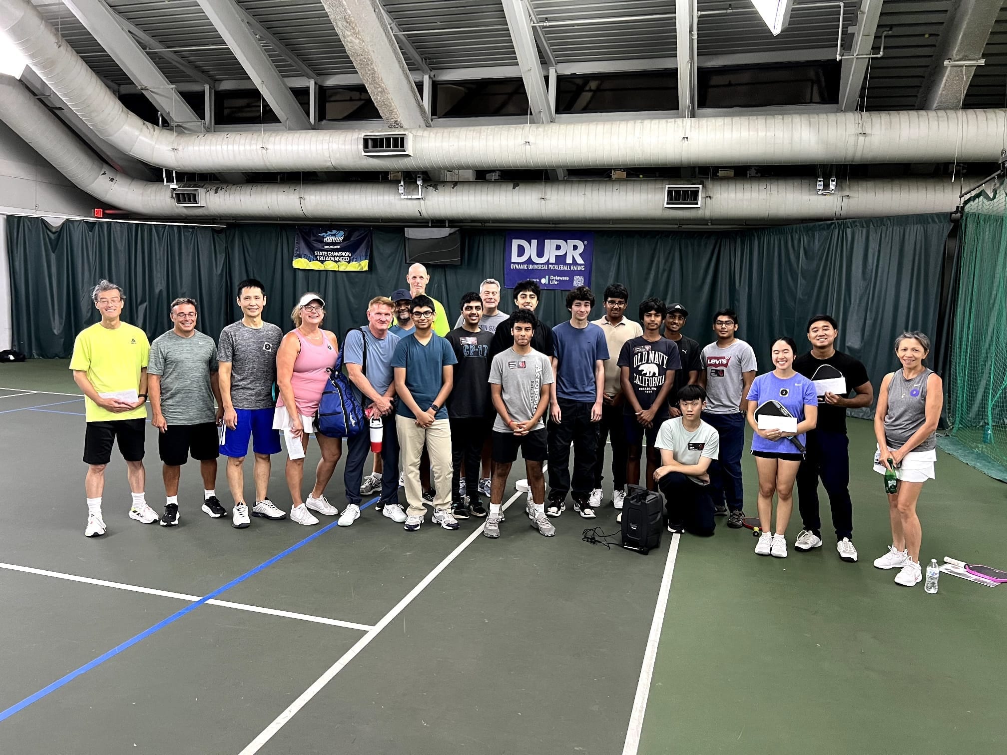 The CourtQuest community gathered on court at the Rally Royale closing ceremony